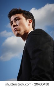 Young Biracial Businessman Standing Before A California Landscape