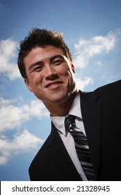 Young Biracial Businessman Standing Before A California Landscape