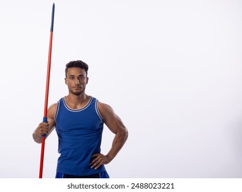 Young biracial man poses with a javelin in a studio setting on a white background. His athletic stance showcases strength and focus, ready for competition. - Powered by Shutterstock