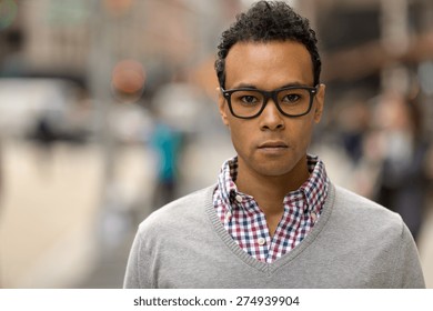 Young Black African Asian Man In City Serious Face Portrait