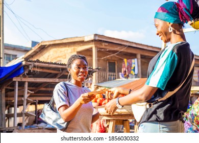 young black african female businesswoman shopping paying bill using cash