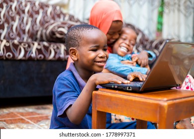 Young Black African Preschool Kid Using Technology Having Online Class At Home