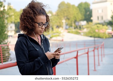 Young Black American Woman Using Her Mobile Phone