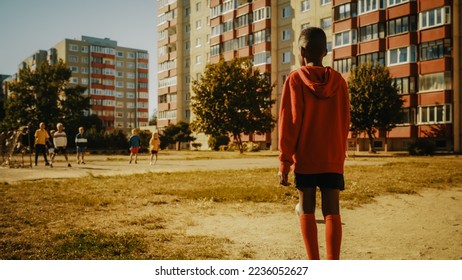 Young Black Boy Playing Soccer with Friends. Multiethnic Kids Enjoying a Game of Football in the Neighborhood. Player Celebrating the Goal with Teammates. - Shutterstock ID 2236052627