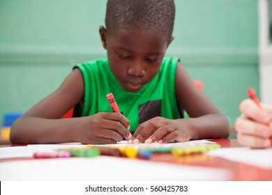 Young Black Boy Thinking In Kindergarten