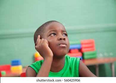 Young Black Boy Thinking In Kindergarten