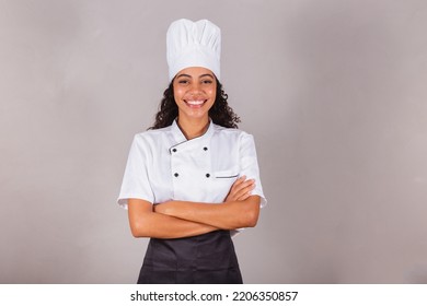 young black brazilian woman, cook, masterchef. With arms crossed. smiling. - Powered by Shutterstock