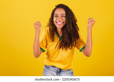 Young Black Brazilian Woman, Soccer Fan. Celebrating And Celebrating.