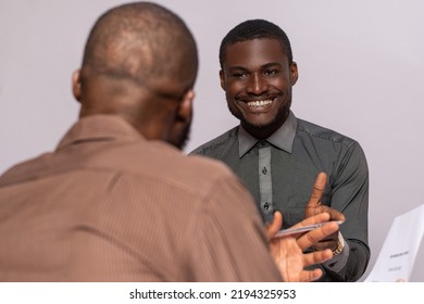young black business man discussing with someone - Shutterstock ID 2194325953