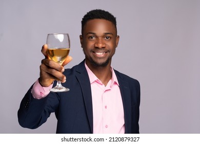 Young Black Business Man Raising A Wine Glass