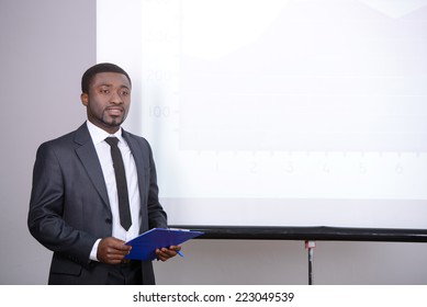 Young Black Businessman Giving Presentation To His Colleagues