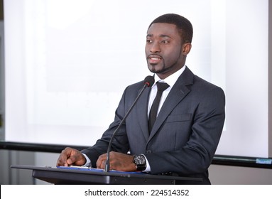 Young Black Businessman Giving Presentation To His Colleagues