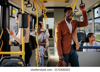 A Young Black Businessman Is Riding A Public Bus