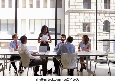 Young Black Businesswoman Addressing Colleagues At A Meeting