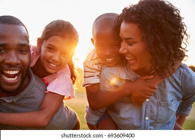 Young black couple enjoying family time with children