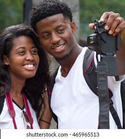 Young Black Couple Smiling And Taking A Selfie Portrait