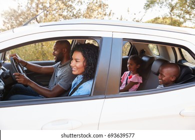 Young Black Family In A Car Smile On The Road Trip