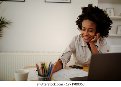 The Young Black Female Architect Working On Project, With Smile And Happy Face.