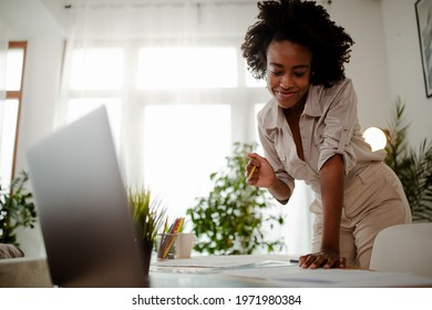 The Young Black Female Architect Working On Project, With Smile And Happy Face.