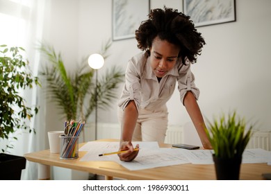 The Young Black Female Architect Working On Project, With Smile And Happy Face.