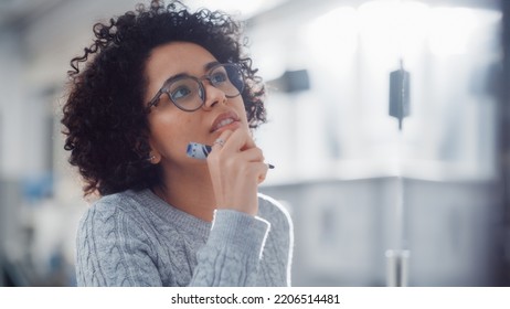 Young Black Female Genius Solves Complex Mathematical Problems And Writing Long Equations On The Whiteboard. Higher Education, Science, Technology And Innovation Concept.