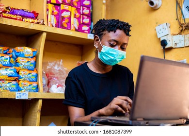 Young Black Female Store Sale Girl Wearing Face Mask Working On Laptop 