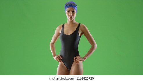 Young Black Female Swimmer In One Piece Swimsuit And Swim Cap On Green Screen