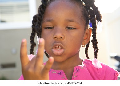 Young Black Girl Counting With Her Fingers