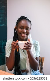 Young Black Girl Drinking Her Coffee At Cafe.