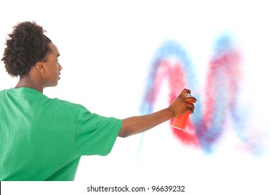 Young Black Graffiti Artist Is Spraying At The Wall