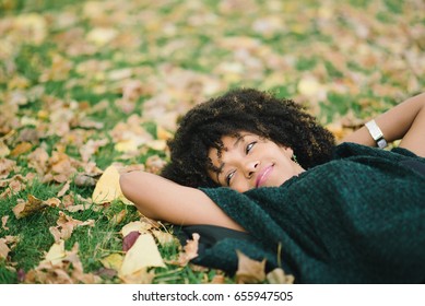 Young Black Happy Woman Relaxing In Autumn. Happiness And Relax Concept.