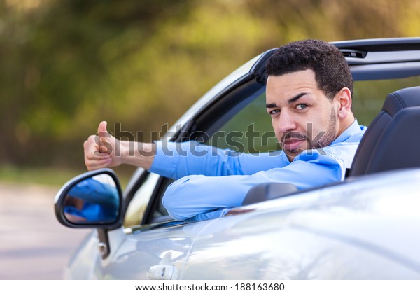 Young black latin american driver making thumbs up
- Black people