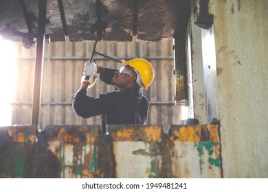 Young Black Male Engineer

Checking Checking And Repair The Machine In Heavy Industry Manufacturing Facility. Service And Maintenance Of Factory Machinery. American African People.