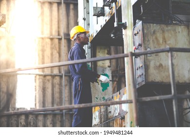 Young Black Male Engineer

Checking Checking And Repair The Machine In Heavy Industry Manufacturing Facility. Service And Maintenance Of Factory Machinery. American African People.