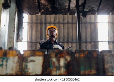 Young Black Male Engineer

Checking Checking And Repair The Machine In Heavy Industry Manufacturing Facility. Service And Maintenance Of Factory Machinery. American African People.