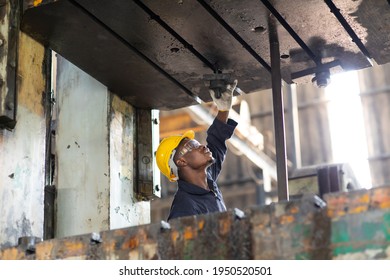 Young Black Male Engineer

Checking Checking And Repair The Machine In Heavy Industry Manufacturing Facility. Service And Maintenance Of Factory Machinery. American African People.