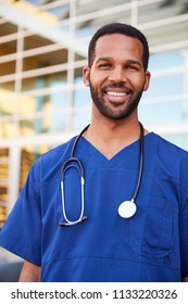 Young Black Male Healthcare Worker Smiling Outside, Vertical