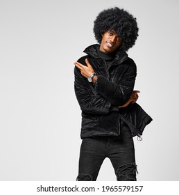 Young Black Male Model In Afro Hair Wear Jacket And Showing Empy Gray Space