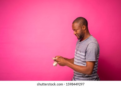 Young Black Man Counting Some Money