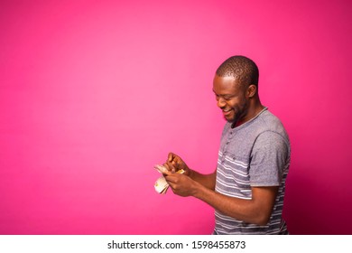 Young Black Man Counting Some Money