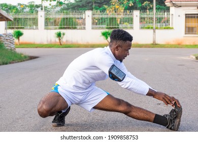 Young Black Man Doing Stretching Exercises