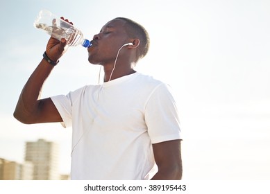 Young Black Man Drinking Water.