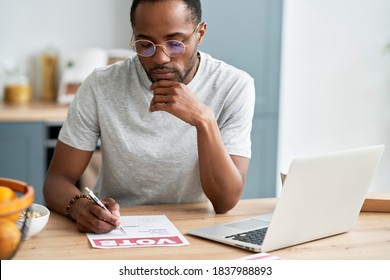 Young Black Man Fulfilling Document Of Mail Voting