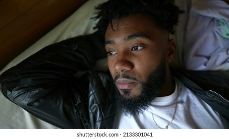 A Young Black Man Getting Up From Bed After Rest