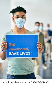 Young Black Man Holding Supportive Placard After Receiving Coronavirus Vaccine During Immunization At Vaccination Center.