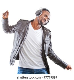 Young Black Man Listening To Music Over His Headphones.