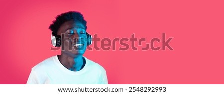 Similar – Young black man listening to music