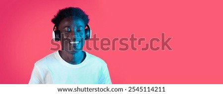 Similar – Young black man listening to music