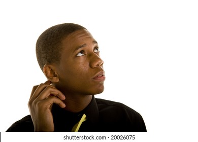 A Young Black Man Thinking About Something And Scratching His Head