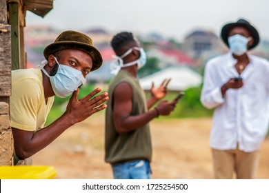 A young black man undergoing digital detoxing - millennial wearing face mask for protection during covid-19 pandemic - concept on practicing social distancing
